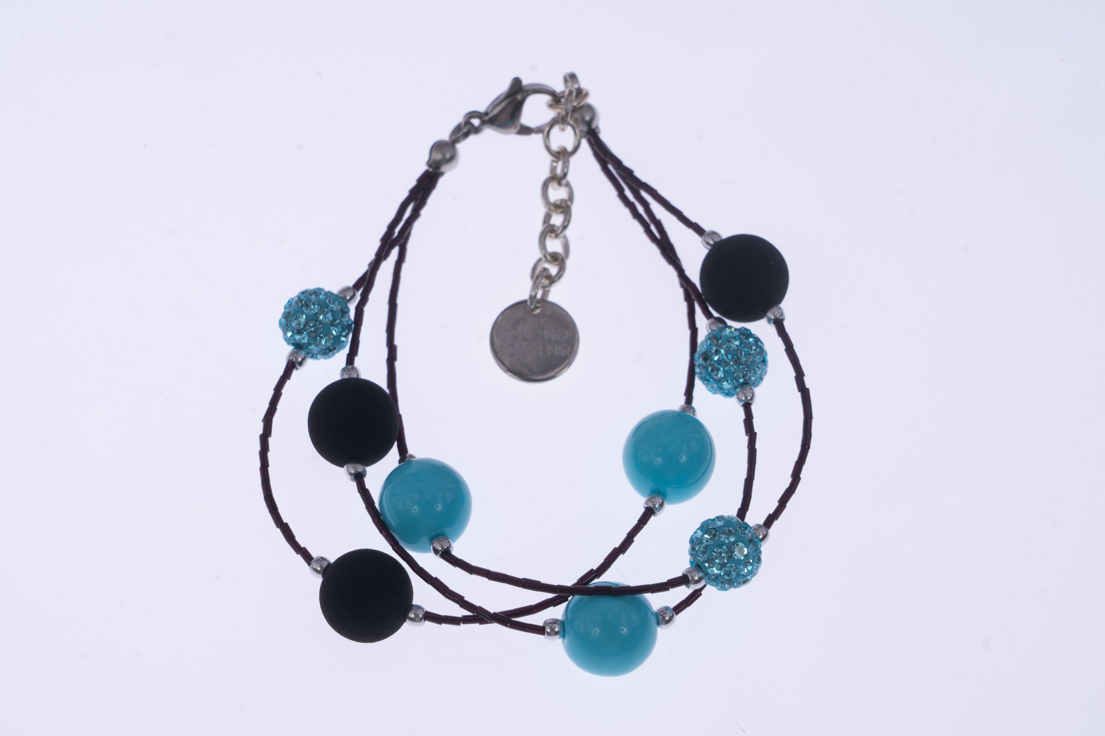 Bracciale di ungioielloperte.com con perle nere in pietra lavica e cristalli Swarovski azzurri