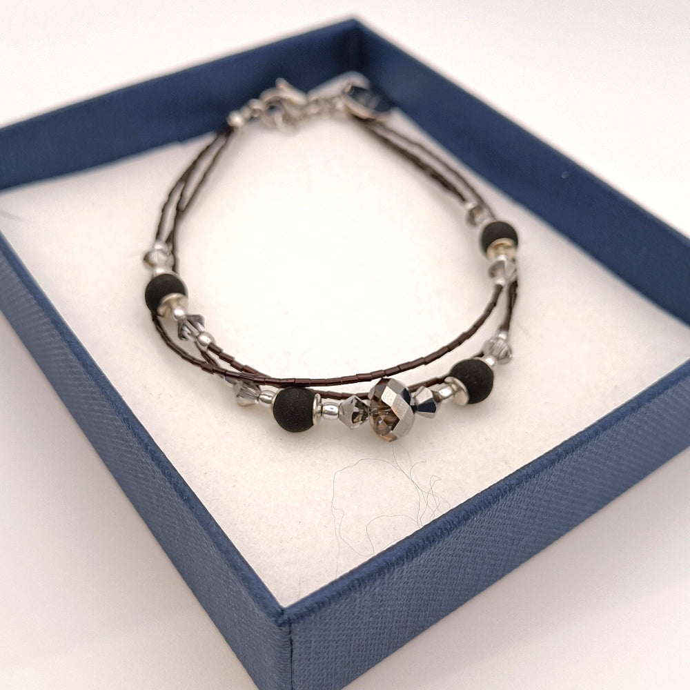 Bracciale con pietra lavica e perle vetro nero - ungioielloperte